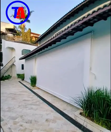 Toldo Cortina com braços em Riviera de São Lourenço